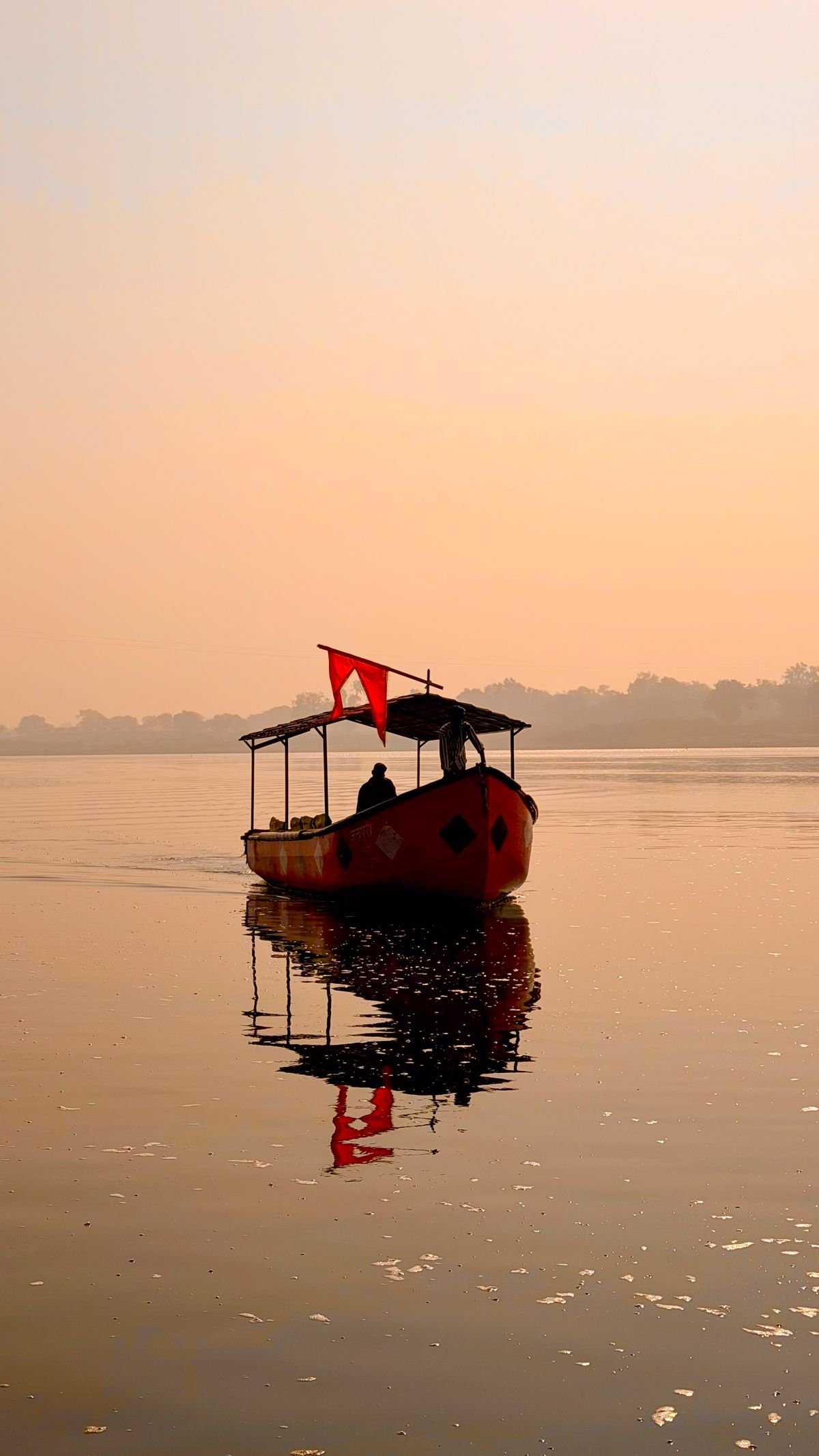 Boat on Narmada river at sunrise